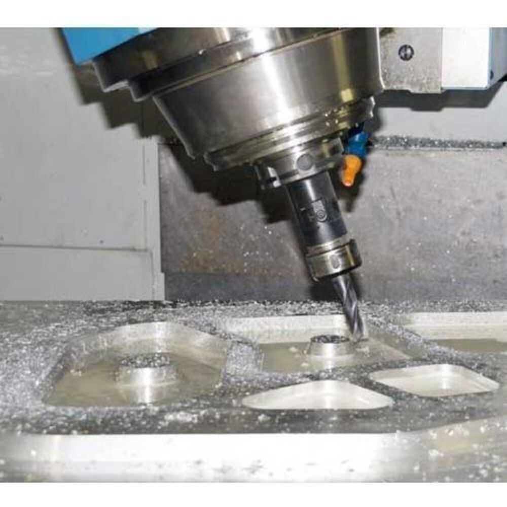 CNC milling machine drilling a precision component